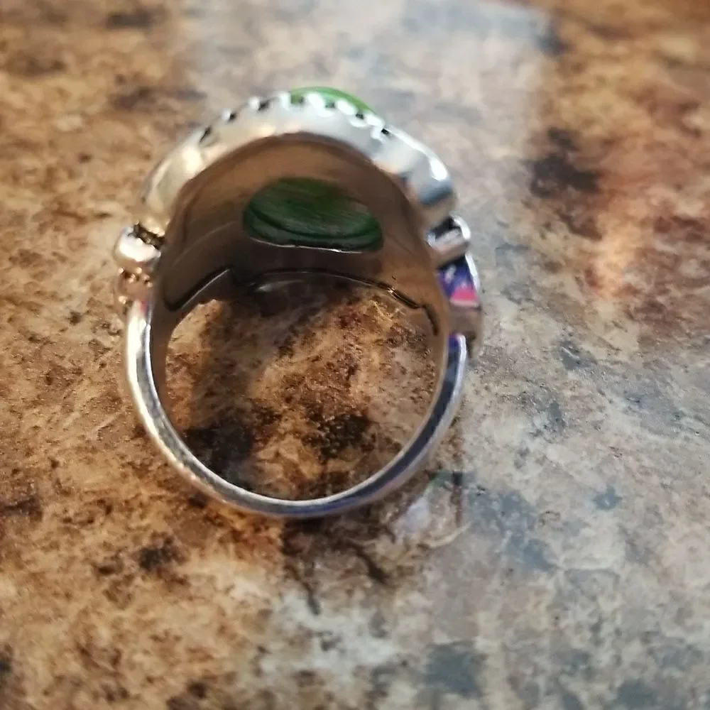 Inlaid turquoise egg shape carved ring size 8